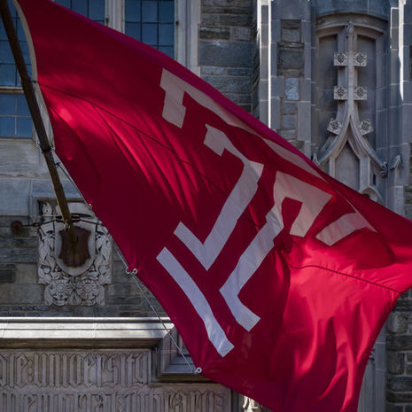 Image of the cherry and white Temple ‘T’ flag outside of Sullivan Hall on Main Campus.