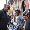 Security officer with kids on Temple University’s Urban Bike Team