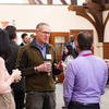 Faculty discussing at event