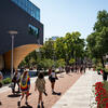 Students walking on Liacouras walk near Charles Library