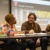 Three faculty members in a classroom setting