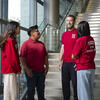 Group of first generation Temple students talking in SERC lobby