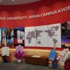 Temple University Kyoto Campus Atrium with flowers and map display