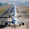 Row of airplanes on runway