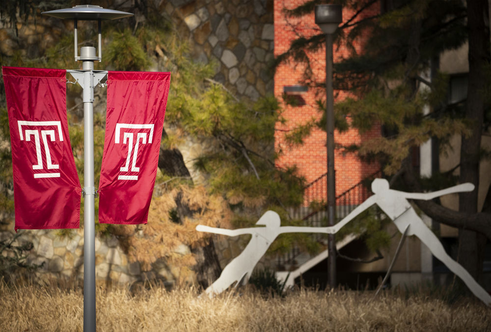 Temple Flags and figure sculpture on campus